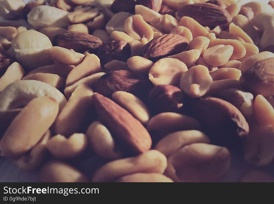 A close up of a pile of different nuts and seeds.