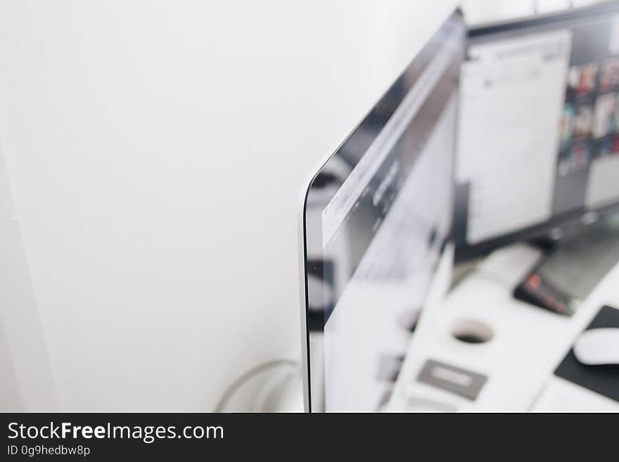 A workstation with two displays on the desk. A workstation with two displays on the desk.