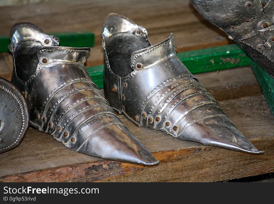 The iron shoes of the knight on the stand