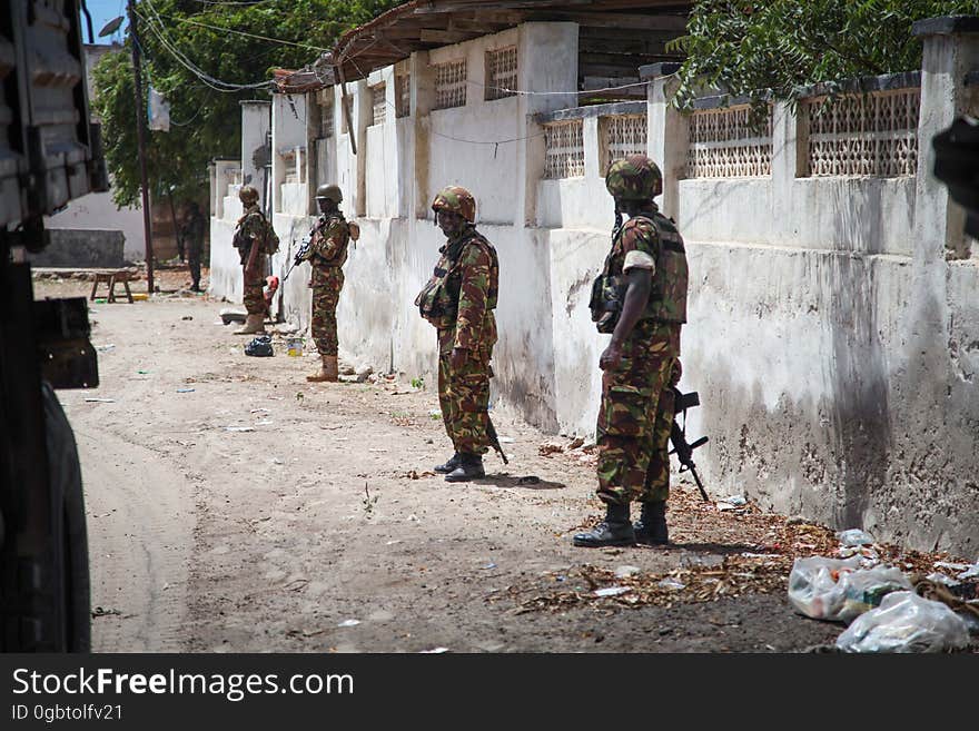 SOMALIA, Kismayo: In a photogaph taken 12 October 2013 and released by the African Union-United Nations Information Support Team 15 October, Kenyan soldiers serving with the African Union Mission in Somalia &#x28;AMISOM&#x29; patrol the streets of the southern Somali port city of Kismayo. October 16 marks two years since the Kenya Defense Force first intervened in Somalia under Operation Linda Nchi - meaning Operation Protect the Country in Kiswahili - following a series of kidnappings and cross-border raids along the Kenya-Somalia border by the Al-Qaeda-affiliated terrorist group Al Shabaab. KDF forces were fully integrated into the African Union mission on 22 February 2012 and saw them capture the strategically and economiclly important port city of Kismayo from Al Shabaab in early October 2012 after a sustained 6-month advance across southern Somalia. AU/UN IST PHOTO / RAMADAN MOHAMED HASSAN. SOMALIA, Kismayo: In a photogaph taken 12 October 2013 and released by the African Union-United Nations Information Support Team 15 October, Kenyan soldiers serving with the African Union Mission in Somalia &#x28;AMISOM&#x29; patrol the streets of the southern Somali port city of Kismayo. October 16 marks two years since the Kenya Defense Force first intervened in Somalia under Operation Linda Nchi - meaning Operation Protect the Country in Kiswahili - following a series of kidnappings and cross-border raids along the Kenya-Somalia border by the Al-Qaeda-affiliated terrorist group Al Shabaab. KDF forces were fully integrated into the African Union mission on 22 February 2012 and saw them capture the strategically and economiclly important port city of Kismayo from Al Shabaab in early October 2012 after a sustained 6-month advance across southern Somalia. AU/UN IST PHOTO / RAMADAN MOHAMED HASSAN.