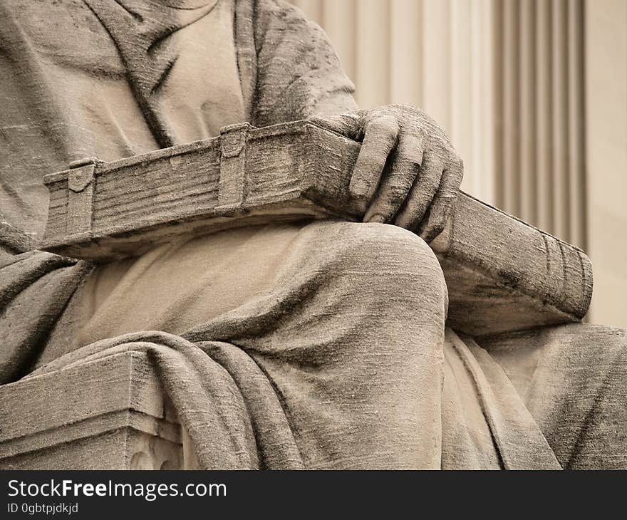 Closed Book With Clasps On The Lap Of Robert Ingersoll Aitken&#x27;s &#x22;Past,&#x22; On The North Side Of The National Archives &#x28;Washington, DC&#x29;