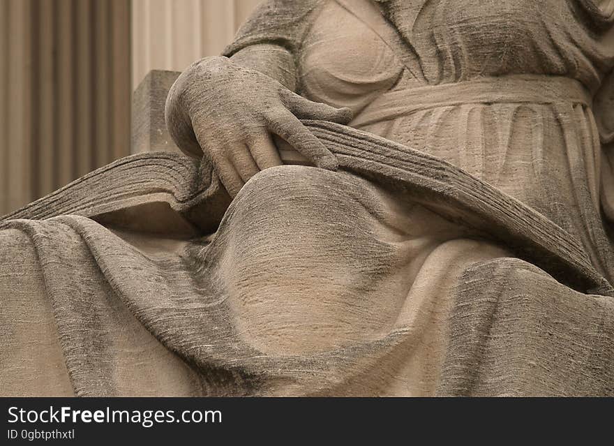 Open Book On The Lap Of Robert Ingersoll Aitken&#x27;s &#x22;Future,&#x22; On The North Side Of The National Archives &#x28;Washington, DC&#x29;