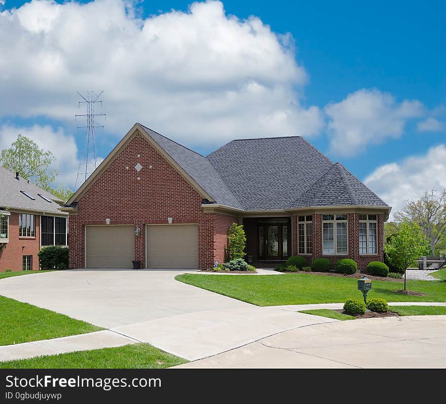 Brick Suburban Home in Summer. Brick Suburban Home in Summer.