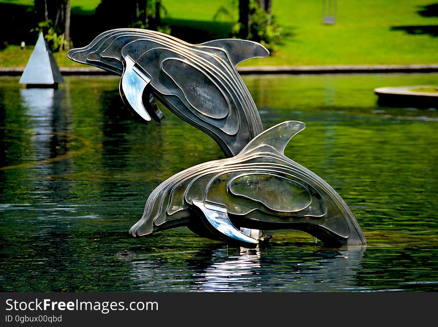 Gray and Brass Metal Dolphin Pool Decor