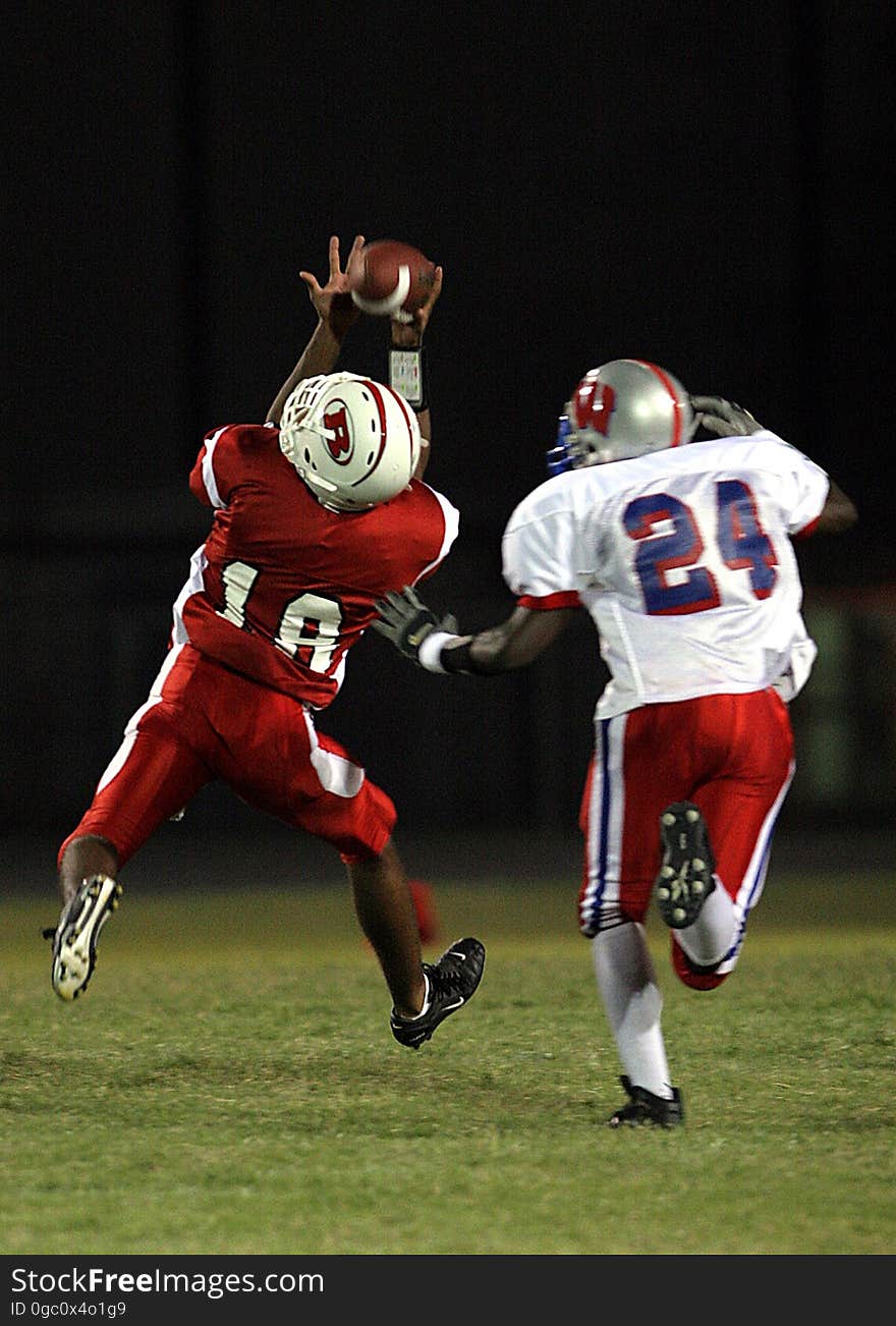 2 Football Player Running After the Ball in Shallow Focus Photography