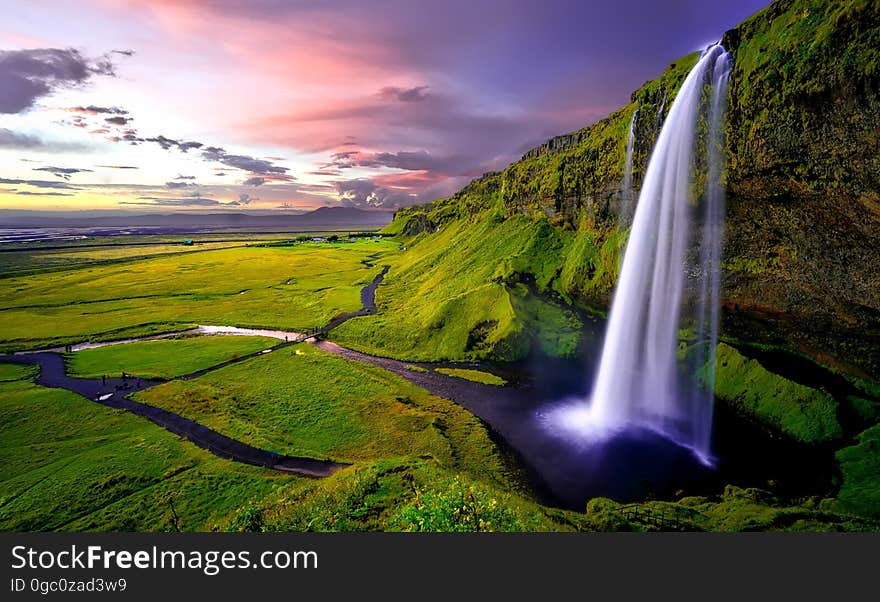 Time Lapse Photography of Waterfalls during Sunset