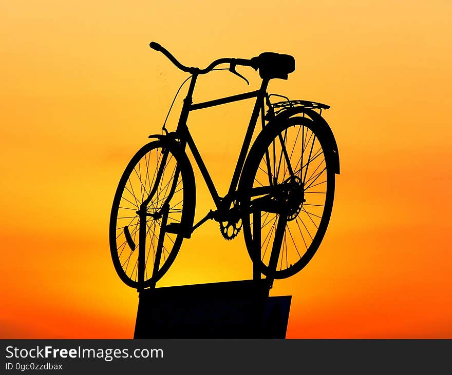 Silhouette of Cruiser Bike during Sunset