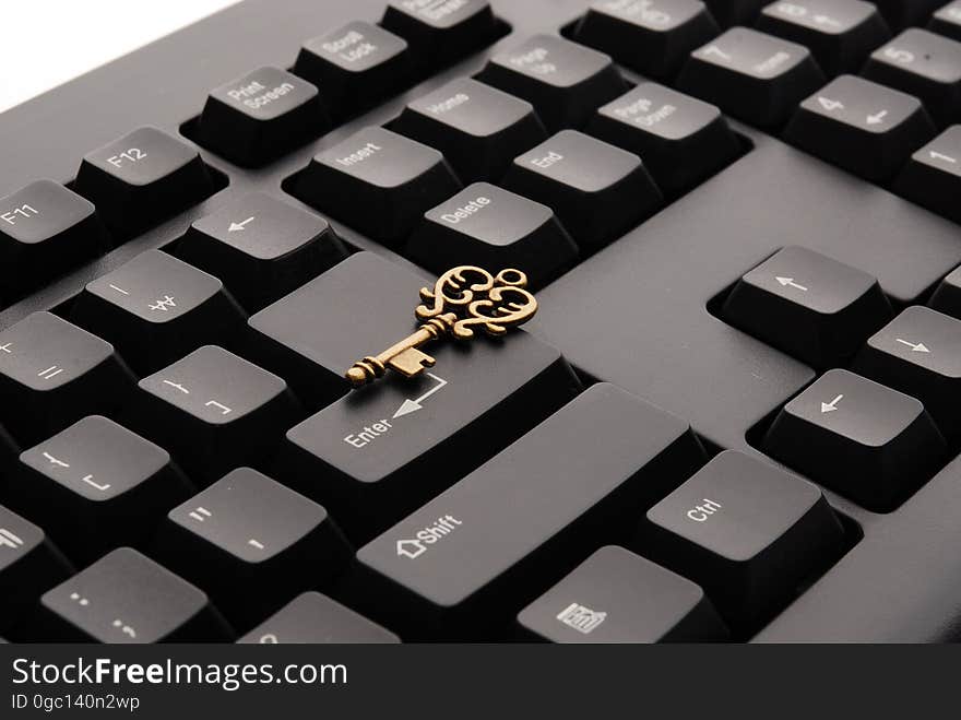 Brass Ornate Vintage Key on Black Computer Keyboard