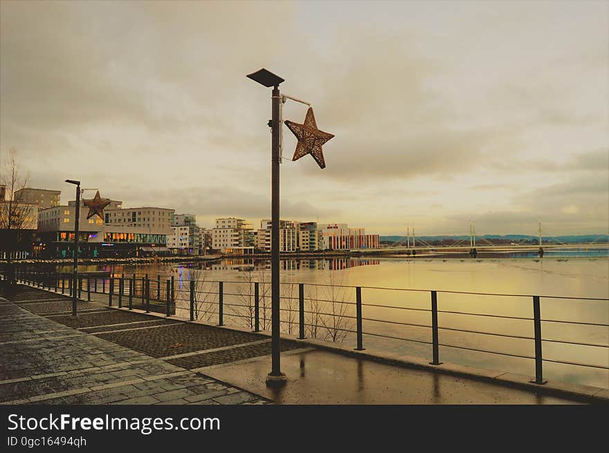 Urban waterfront promenade on stormy overcast day. Urban waterfront promenade on stormy overcast day.