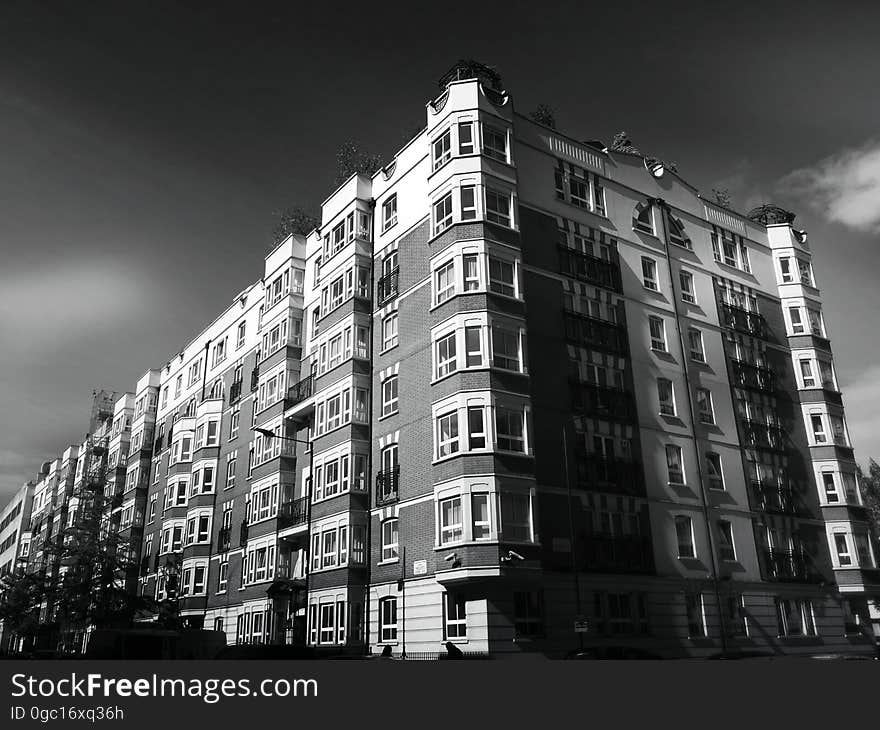 Angular corner of apartment block exterior in black and white. Angular corner of apartment block exterior in black and white.