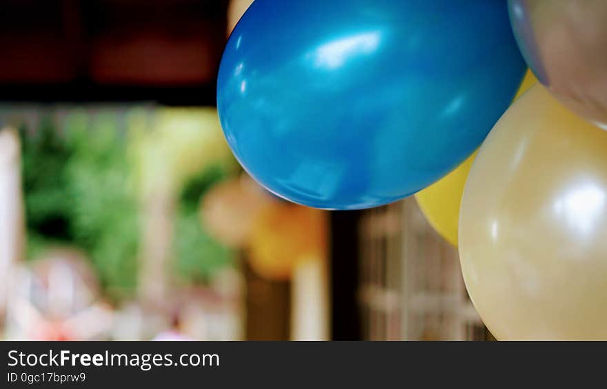 Close up of colorful balloons inflated indoors.