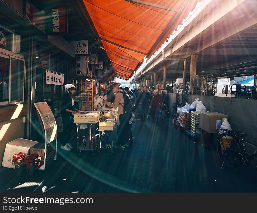 Sunlight over stalls inside covered market. Sunlight over stalls inside covered market.