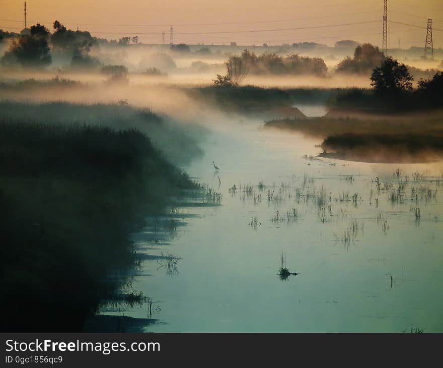 Mist over banks of river at sunrise. Mist over banks of river at sunrise.