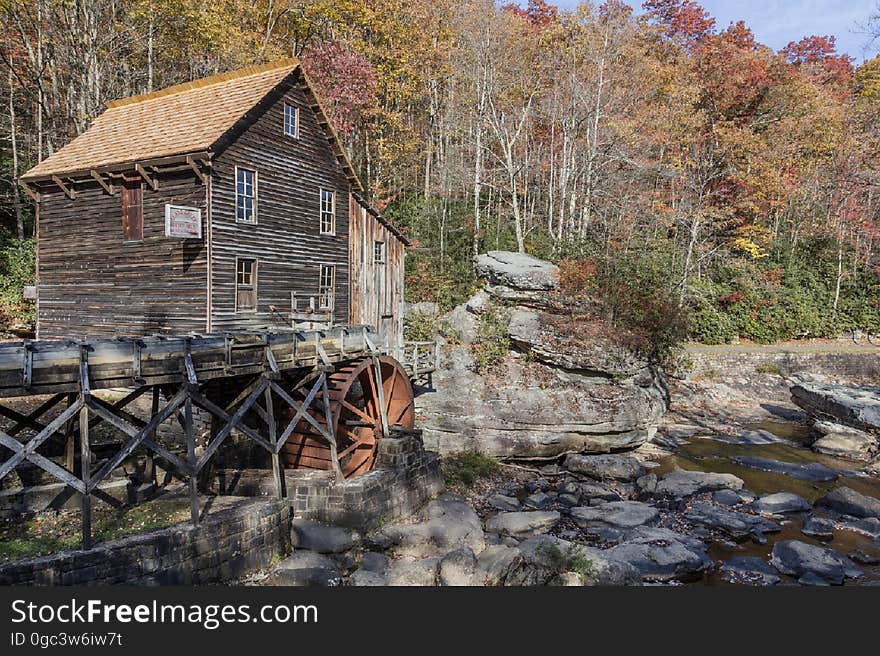 Brown Cabin Under Water Wheel