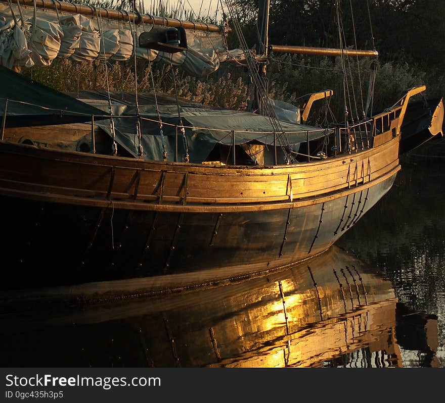 Boat hull reflecting in water at night. Boat hull reflecting in water at night