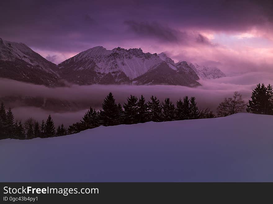 Scenic View of Lake Against Dramatic Sky at Sunset