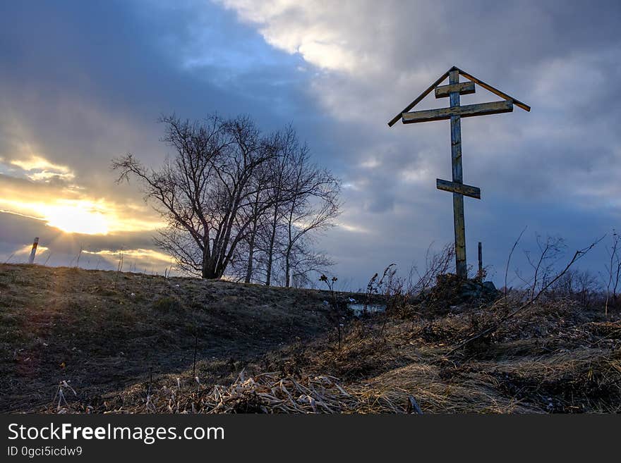 A wooden cross near the village protects from evil spirits. A wooden cross near the village protects from evil spirits