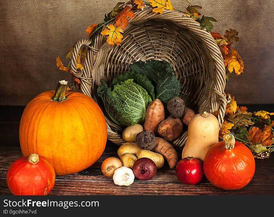 Autumn pumpkins and gourds with wicker basket and fall foliage. Autumn pumpkins and gourds with wicker basket and fall foliage.