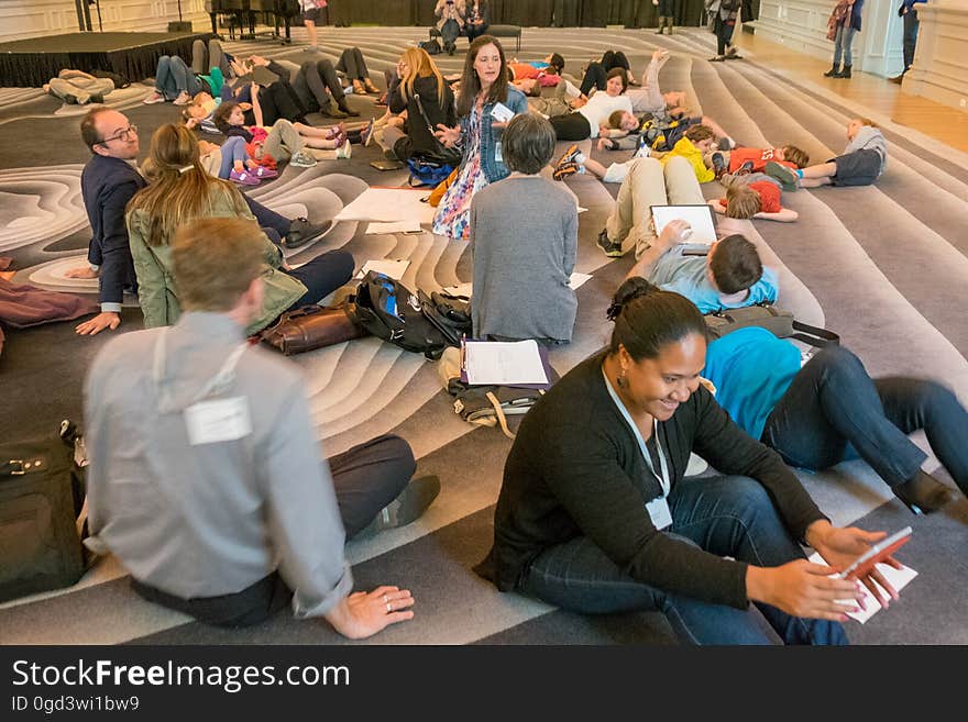 Jeans, Social group, Interaction, Community, Chair, Suit