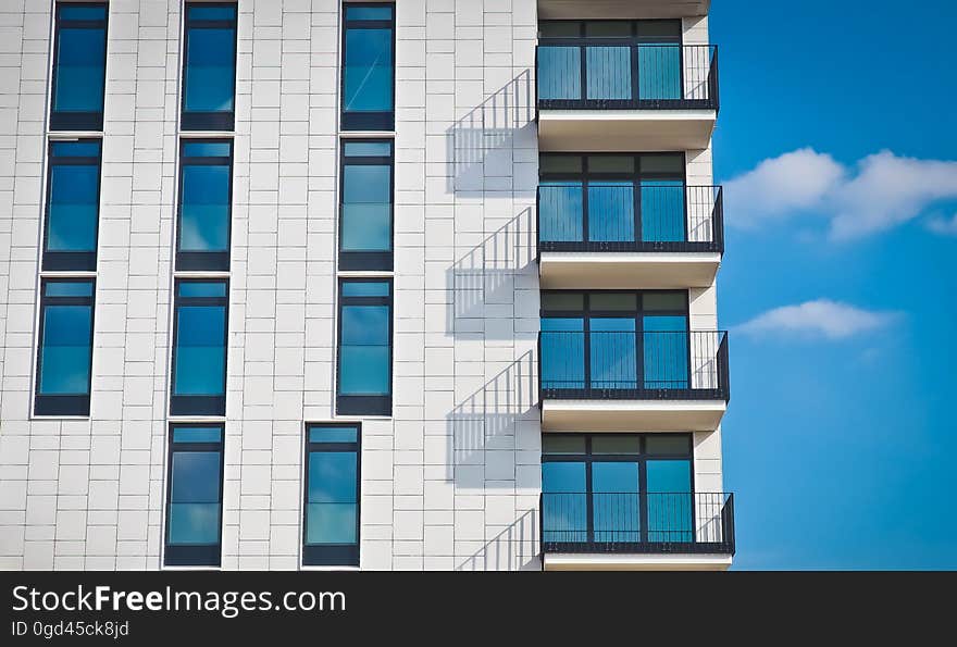 A modern apartment building against the blue skies.