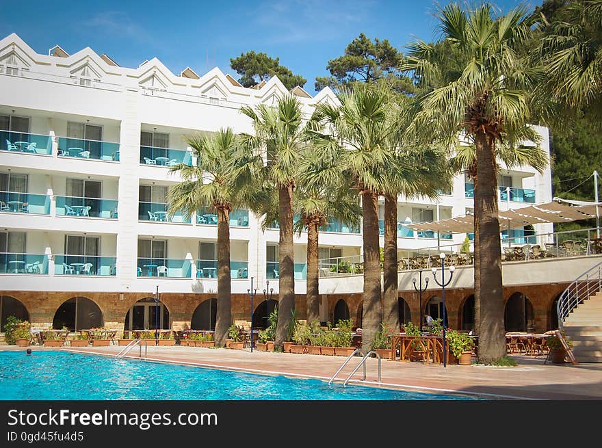 A holiday resort hotel with an outdoor pool. A holiday resort hotel with an outdoor pool.