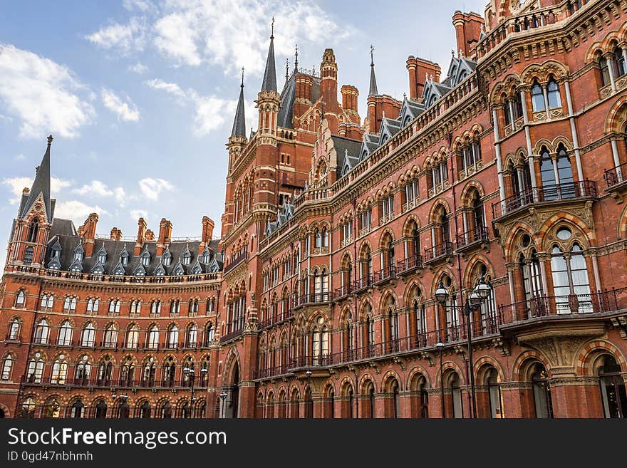 Brown Building during Sunny Blue Cloudy Sky