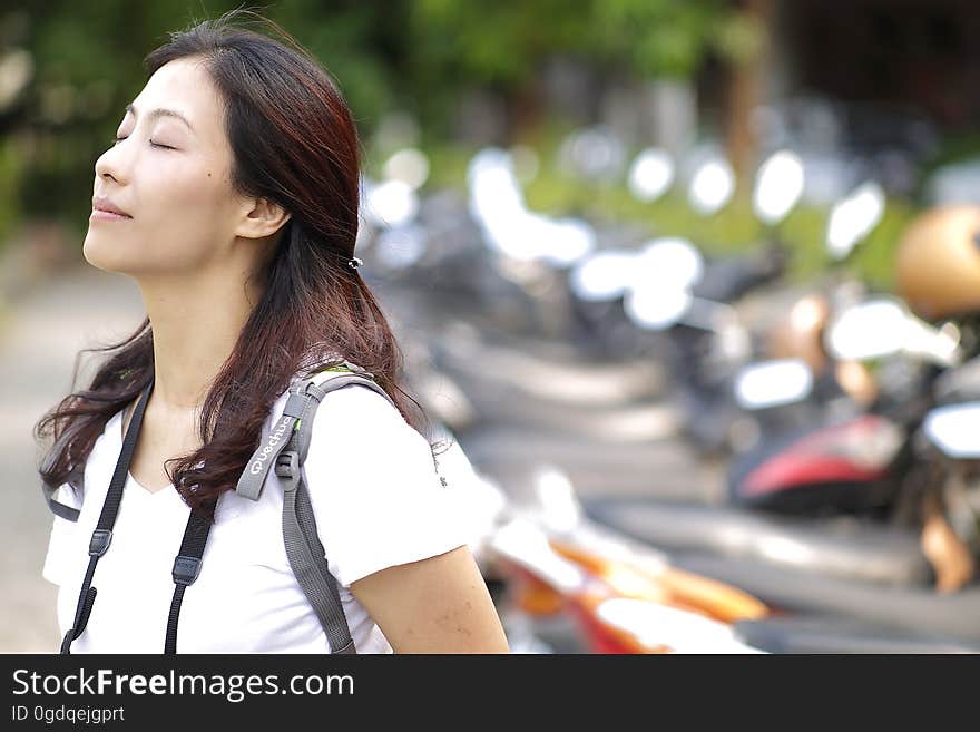 Macro Photography of Woman Wearing White Vneck Shirt