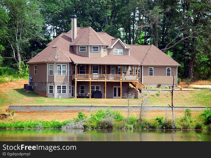 A large modern house on an acreage.