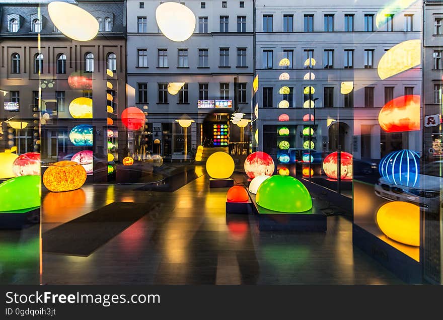 A display of lanterns and building reflections. A display of lanterns and building reflections.