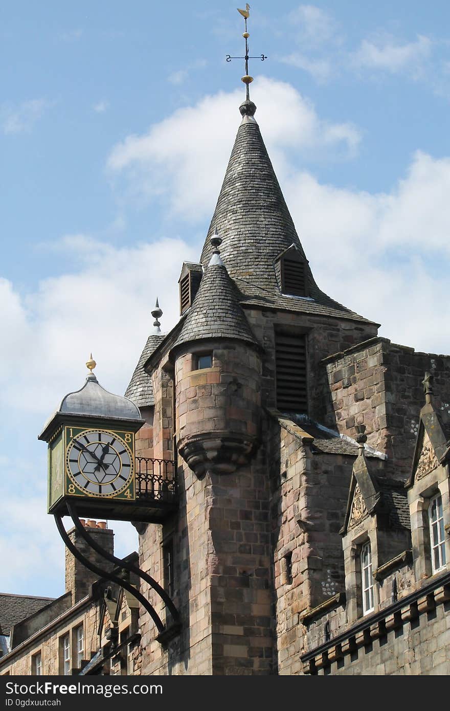 The clock and the tower on the Canongate Tolbooth on the lower section of the Royal Mile in Edinburgh, Scotland. The clock and the tower on the Canongate Tolbooth on the lower section of the Royal Mile in Edinburgh, Scotland.