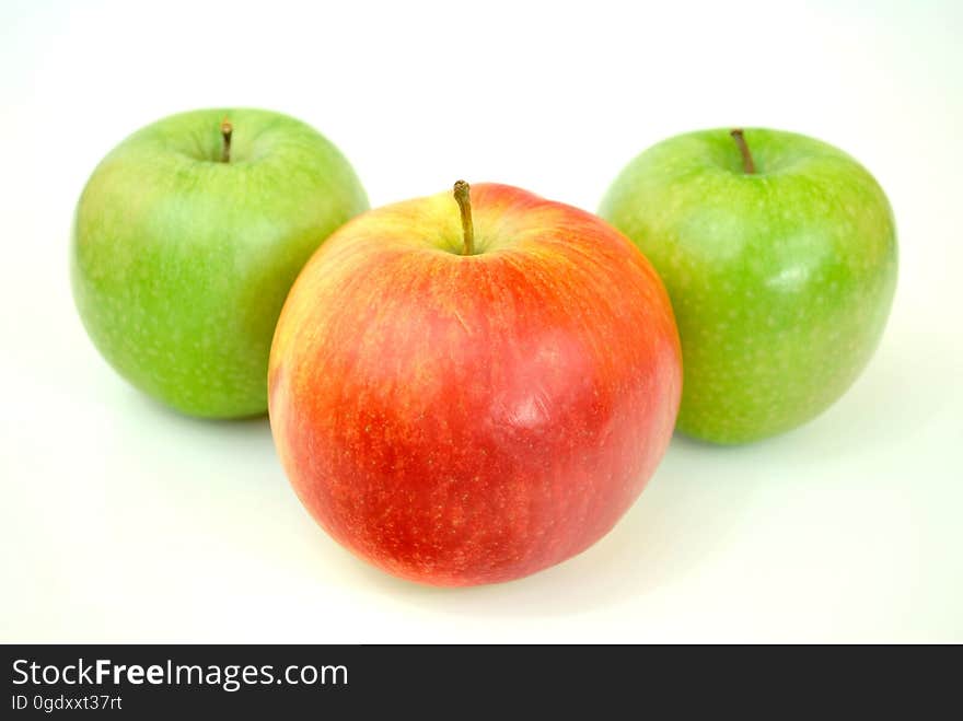 Red Apple With Two Green Apples