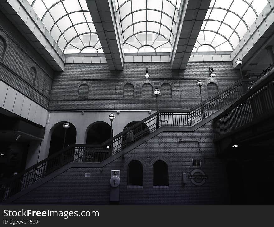 A modern building with stairs and skylights in the ceiling. A modern building with stairs and skylights in the ceiling.