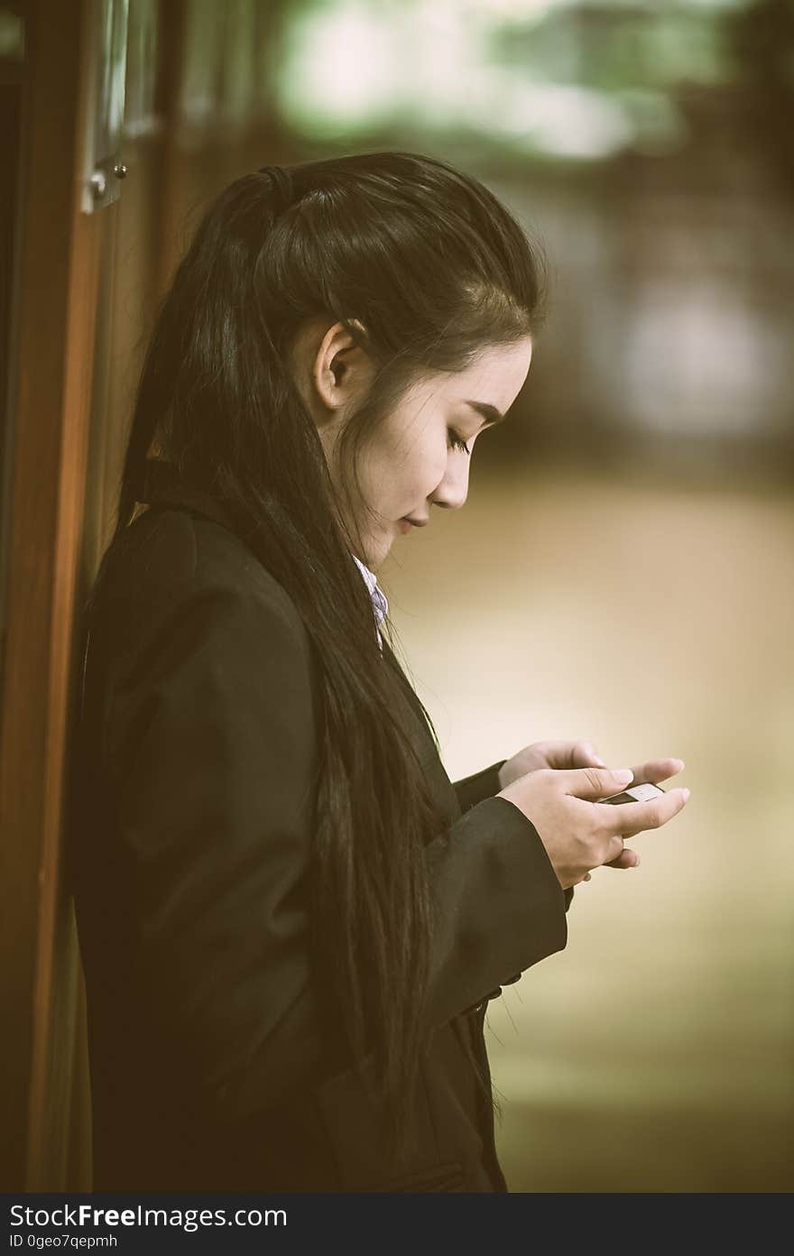 Young business woman using writing text or sent email in smartphone in office. Young business woman using writing text or sent email in smartphone in office