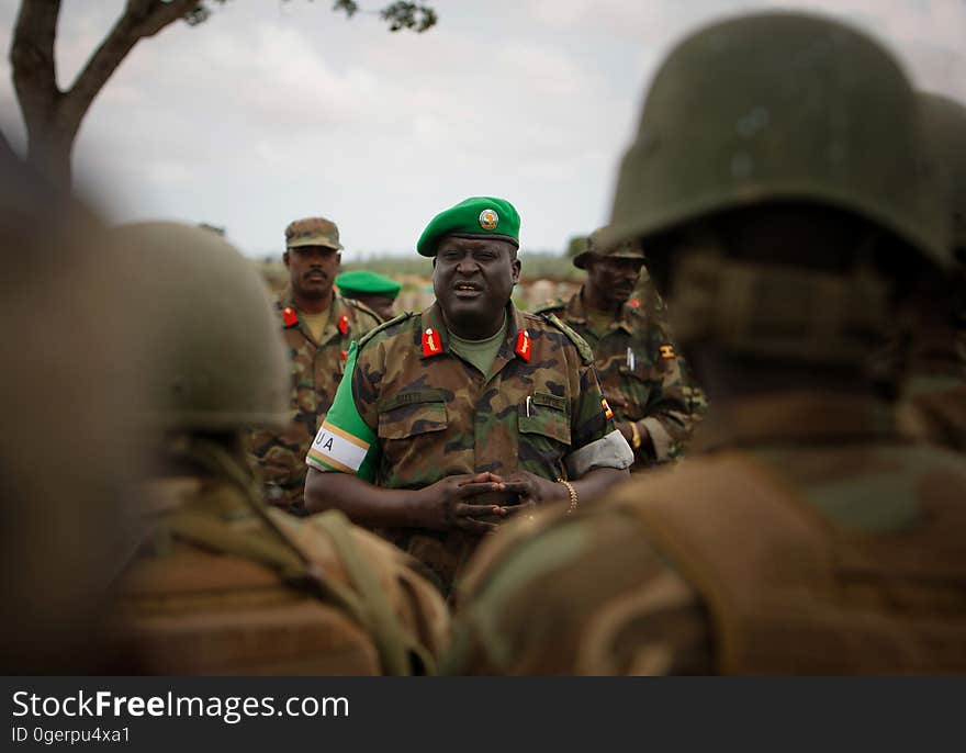 African Union Mission in Somalia &#x28;AMISOM&#x29; Force Commander Lt. Gen. Andrew Gutti addresses Ugandan soldiers serving with the AU operation 5 June in Afgoye located 30km to the west of the Somali capital Mogadishu. AMISOM supporting Somali National Army &#x28;SNA&#x29; forces recently liberated the Afgoye Corridor from the Al Qaeda-affiliated extremist group Al Shabaab, pushing them further away from Mogadishu and opening up the free flow of goods and produce between the fertile agricultural area surrounding Afgoye and the Somali capital. AU-UN IST PHOTO / STUART PRICE. African Union Mission in Somalia &#x28;AMISOM&#x29; Force Commander Lt. Gen. Andrew Gutti addresses Ugandan soldiers serving with the AU operation 5 June in Afgoye located 30km to the west of the Somali capital Mogadishu. AMISOM supporting Somali National Army &#x28;SNA&#x29; forces recently liberated the Afgoye Corridor from the Al Qaeda-affiliated extremist group Al Shabaab, pushing them further away from Mogadishu and opening up the free flow of goods and produce between the fertile agricultural area surrounding Afgoye and the Somali capital. AU-UN IST PHOTO / STUART PRICE.