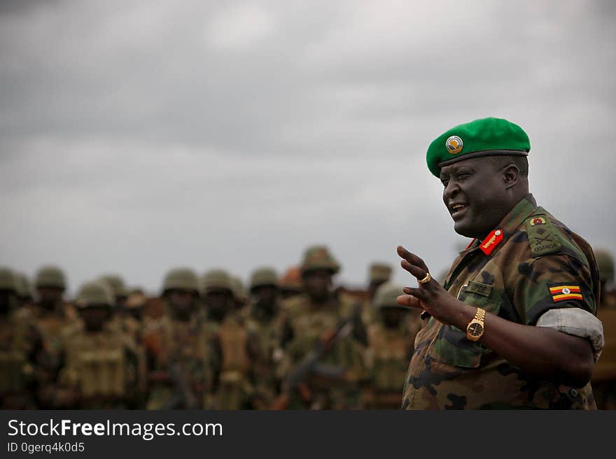 African Union Mission in Somalia &#x28;AMISOM&#x29; Force Commander Lt. Gen. Andrew Gutti addresses Ugandan soldiers serving with the AU operation 5 June in Afgoye located 30km to the west of the Somali capital Mogadishu. AMISOM supporting Somali National Army &#x28;SNA&#x29; forces recently liberated the Afgoye Corridor from the Al Qaeda-affiliated extremist group Al Shabaab, pushing them further away from Mogadishu and opening up the free flow of goods and produce between the fertile agricultural area surrounding Afgoye and the Somali capital. AU-UN IST PHOTO / STUART PRICE. African Union Mission in Somalia &#x28;AMISOM&#x29; Force Commander Lt. Gen. Andrew Gutti addresses Ugandan soldiers serving with the AU operation 5 June in Afgoye located 30km to the west of the Somali capital Mogadishu. AMISOM supporting Somali National Army &#x28;SNA&#x29; forces recently liberated the Afgoye Corridor from the Al Qaeda-affiliated extremist group Al Shabaab, pushing them further away from Mogadishu and opening up the free flow of goods and produce between the fertile agricultural area surrounding Afgoye and the Somali capital. AU-UN IST PHOTO / STUART PRICE.