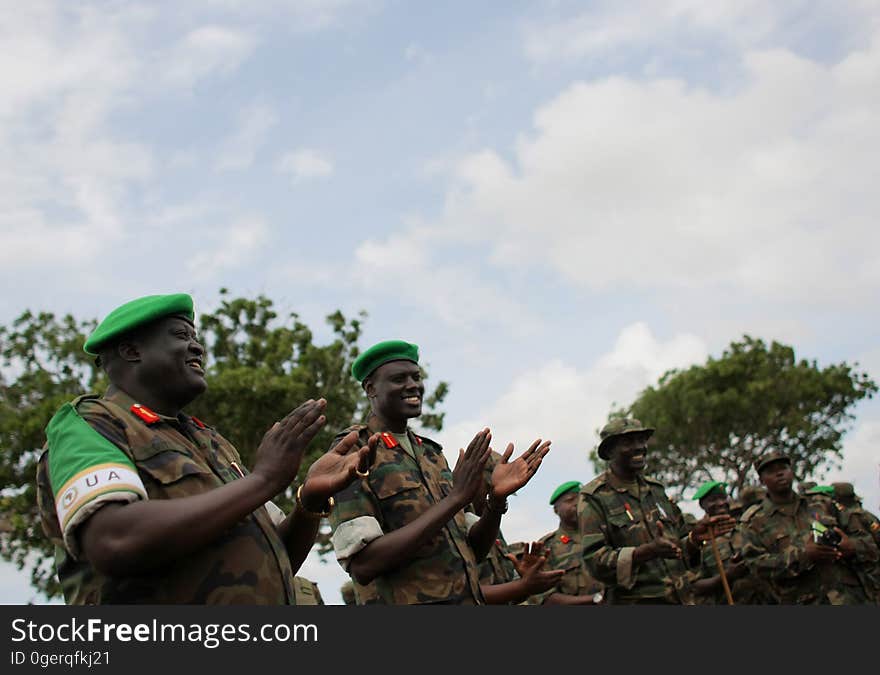 African Union Mission in Somalia &#x28;AMISOM&#x29; Force Commander Lt. Gen. Andrew Gutti &#x28;left&#x29; gestures with Brigadier Paul Lokech, Commander for the Ugandan Contigent serving with the AU operation during the recital of a patriotic song sung by Ugandan soldiers 5 June in Afgoye located 30km to the west of the Somali capital Mogadishu. AMISOM supporting Somali National Army &#x28;SNA&#x29; forces recently liberated the Afgoye Corridor from the Al Qaeda-affiliated extremist group Al Shabaab, pushing them further away from Mogadishu and opening up the free flow of goods and produce between the fertile agricultural area surrounding Afgoye and the Somali capital. AU-UN IST PHOTO / STUART PRICE. African Union Mission in Somalia &#x28;AMISOM&#x29; Force Commander Lt. Gen. Andrew Gutti &#x28;left&#x29; gestures with Brigadier Paul Lokech, Commander for the Ugandan Contigent serving with the AU operation during the recital of a patriotic song sung by Ugandan soldiers 5 June in Afgoye located 30km to the west of the Somali capital Mogadishu. AMISOM supporting Somali National Army &#x28;SNA&#x29; forces recently liberated the Afgoye Corridor from the Al Qaeda-affiliated extremist group Al Shabaab, pushing them further away from Mogadishu and opening up the free flow of goods and produce between the fertile agricultural area surrounding Afgoye and the Somali capital. AU-UN IST PHOTO / STUART PRICE.