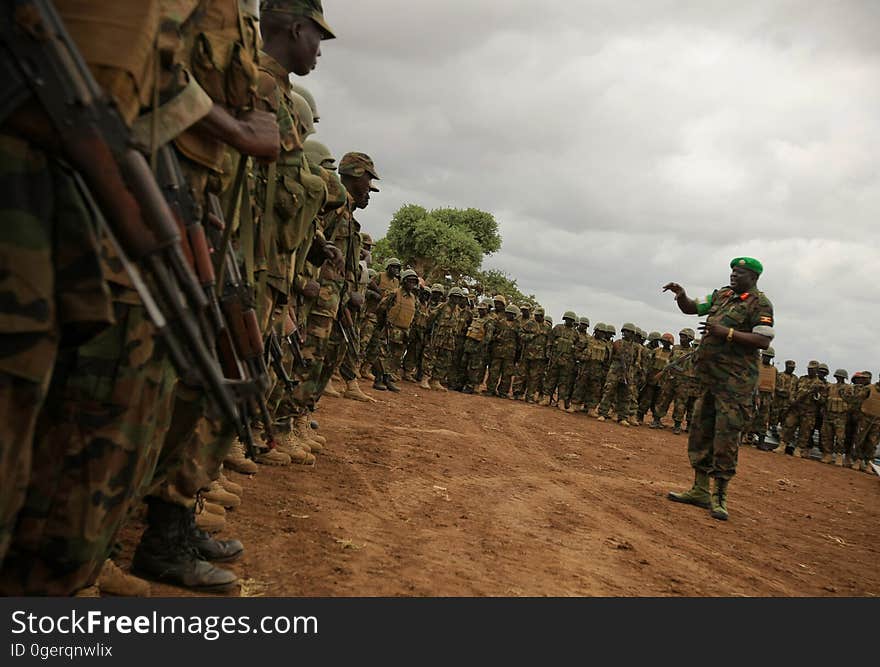 African Union Mission in Somalia &#x28;AMISOM&#x29; Force Commander Lt. Gen. Andrew Gutti addresses Ugandan soldiers serving with the AU operation 5 June in Afgoye located 30km to the west of the Somali capital Mogadishu. AMISOM supporting Somali National Army &#x28;SNA&#x29; forces recently liberated the Afgoye Corridor from the Al Qaeda-affiliated extremist group Al Shabaab, pushing them further away from Mogadishu and opening up the free flow of goods and produce between the fertile agricultural area surrounding Afgoye and the Somali capital. AU-UN IST PHOTO / STUART PRICE. African Union Mission in Somalia &#x28;AMISOM&#x29; Force Commander Lt. Gen. Andrew Gutti addresses Ugandan soldiers serving with the AU operation 5 June in Afgoye located 30km to the west of the Somali capital Mogadishu. AMISOM supporting Somali National Army &#x28;SNA&#x29; forces recently liberated the Afgoye Corridor from the Al Qaeda-affiliated extremist group Al Shabaab, pushing them further away from Mogadishu and opening up the free flow of goods and produce between the fertile agricultural area surrounding Afgoye and the Somali capital. AU-UN IST PHOTO / STUART PRICE.