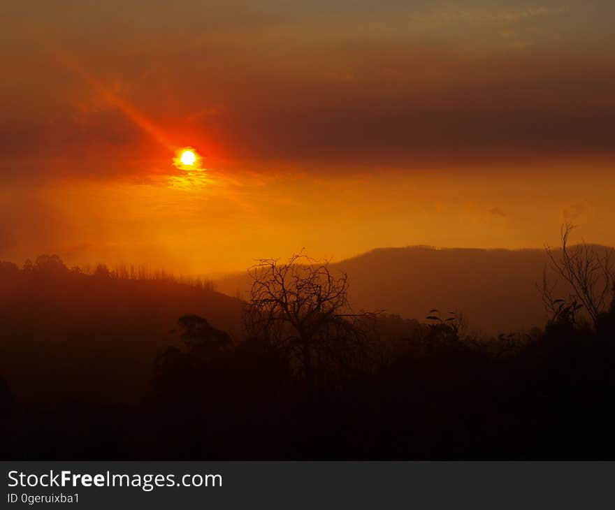 A glowing sunset over the hills. A glowing sunset over the hills.