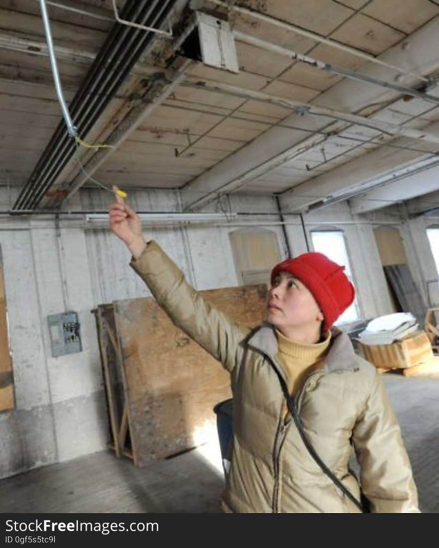 Sarah Cui shows a wire that was deliberately cut by locals at a warehouse where vandalism occurred to property owned by Buddhist community in Amsterdam, NY. Sarah Cui shows a wire that was deliberately cut by locals at a warehouse where vandalism occurred to property owned by Buddhist community in Amsterdam, NY.