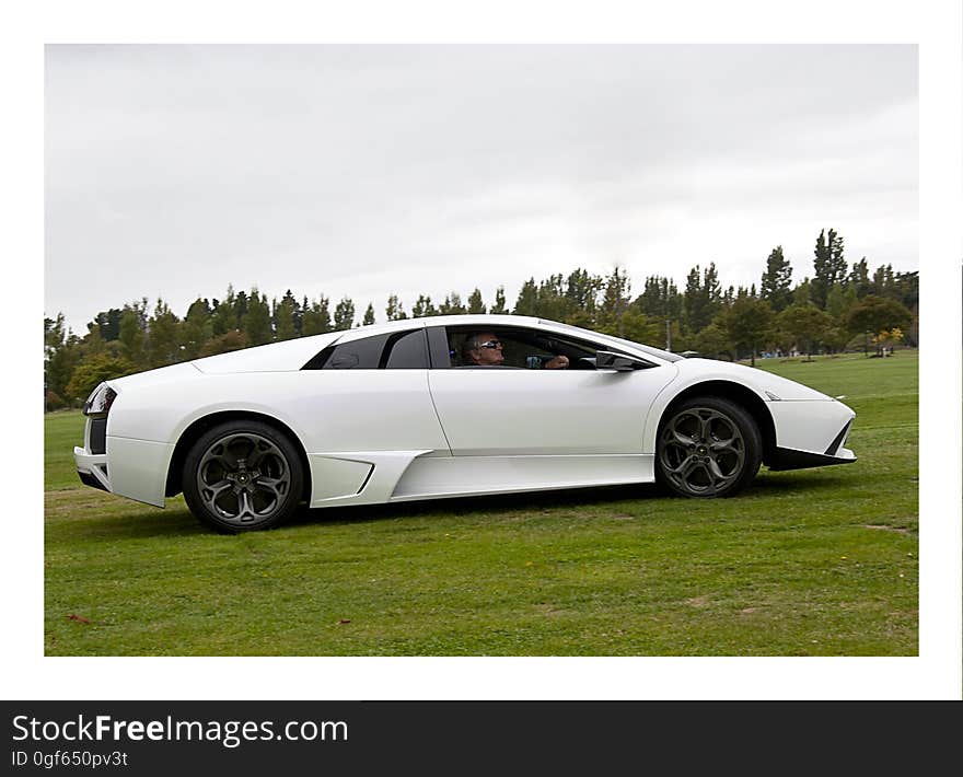 Christchurch,New Zealand - Mars 09,2014 Car enthusiast driving a Lamborghini Murcielago from 2008 in a classic car cavalcade the Twin Rivers Car Parade. The car parade is held every year in Christchurch in New Zealand