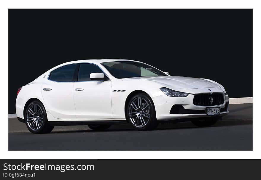 MASERATI GHIBLI from 2014 is parked on a street in the centaral of Christchurch,New Zealand. MASERATI GHIBLI from 2014 is parked on a street in the centaral of Christchurch,New Zealand