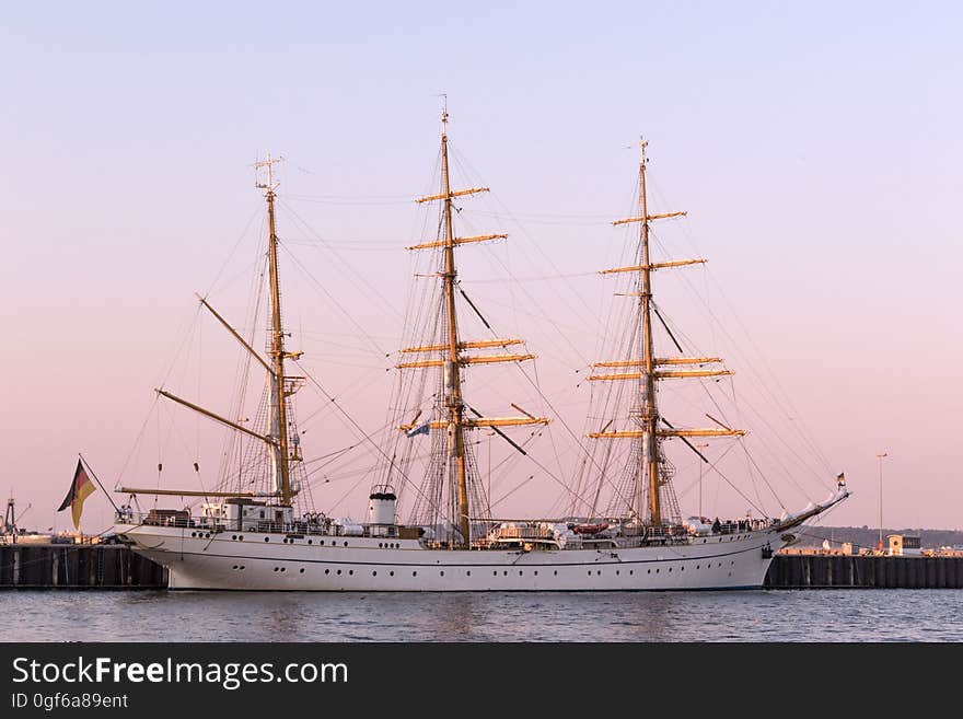 Gorch Fock, a tall ship of the German Navy in the harbor at sunset. Gorch Fock, a tall ship of the German Navy in the harbor at sunset.