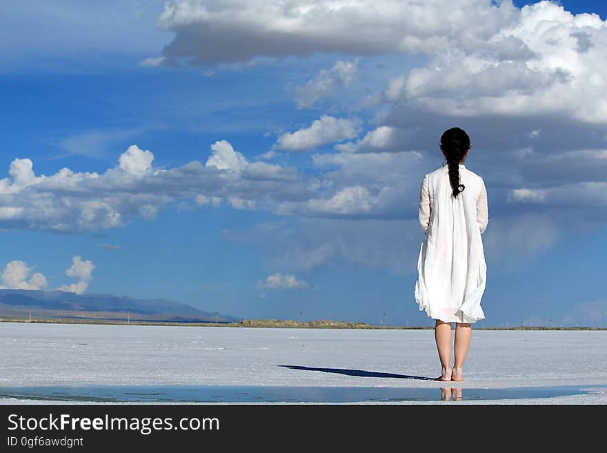 Woman With Umbrella on Beach