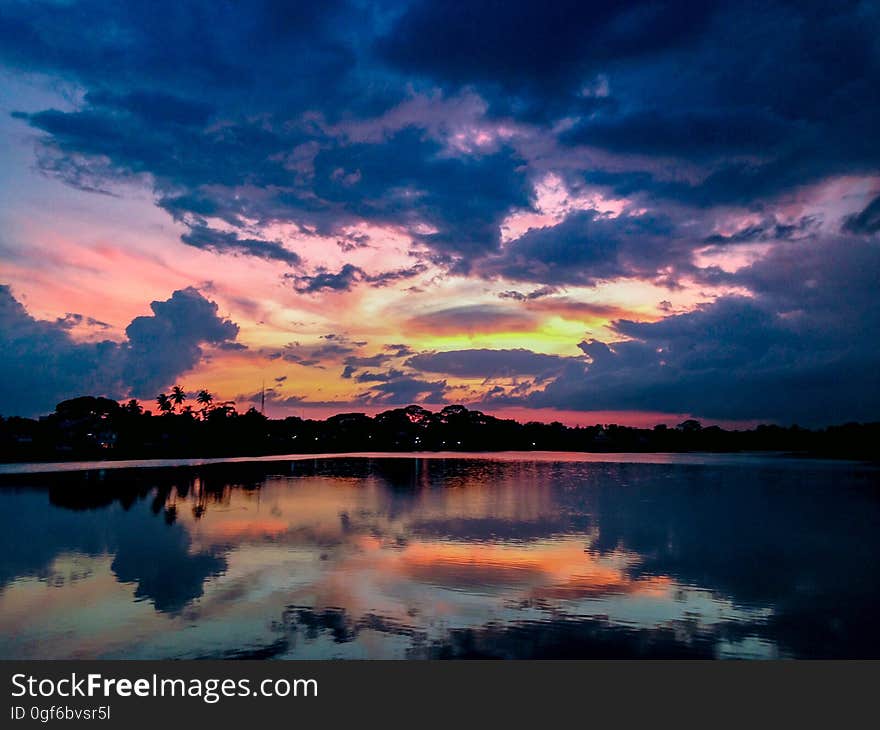 A sunset reflecting on water. A sunset reflecting on water.