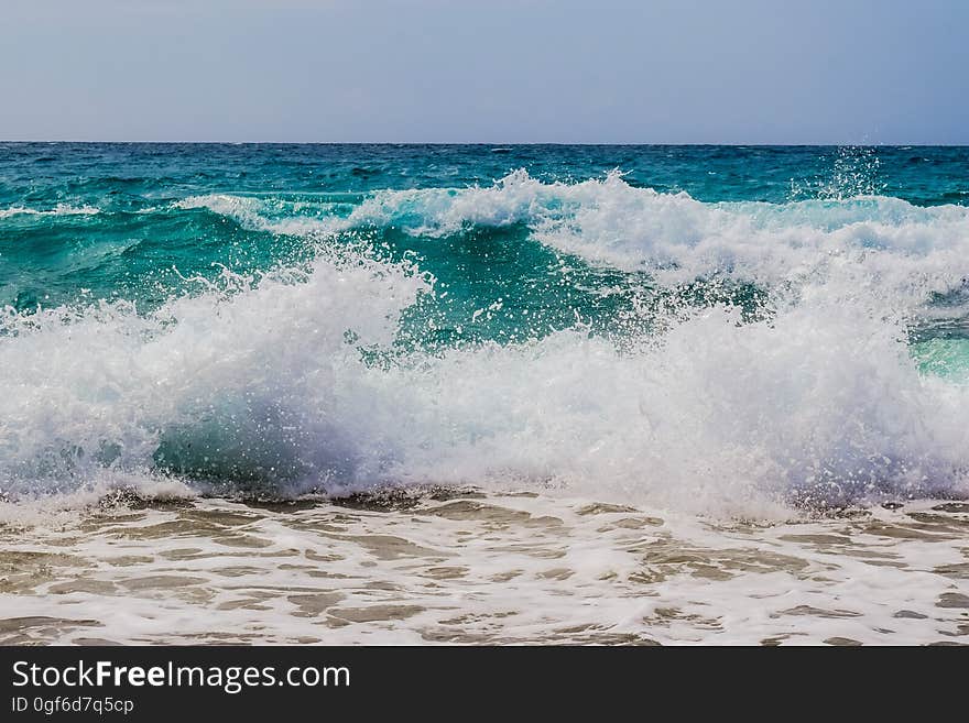 Waves breaking on the shore on the seacoast.