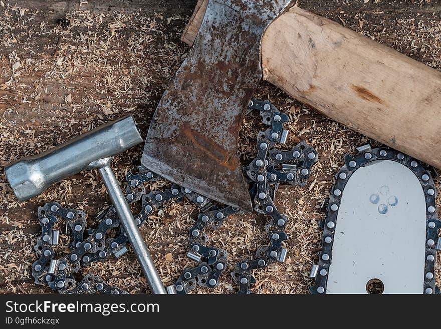 Tools for cutting trees. Bus chainsaw, axe chain. Tools for cutting trees. Bus chainsaw, axe chain