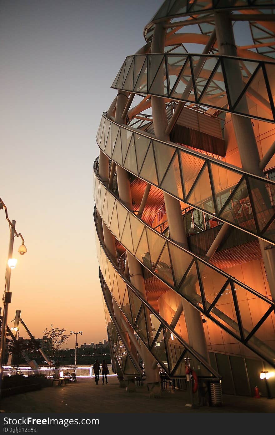 2 Person Walking Beside Dome Shape Designers Building