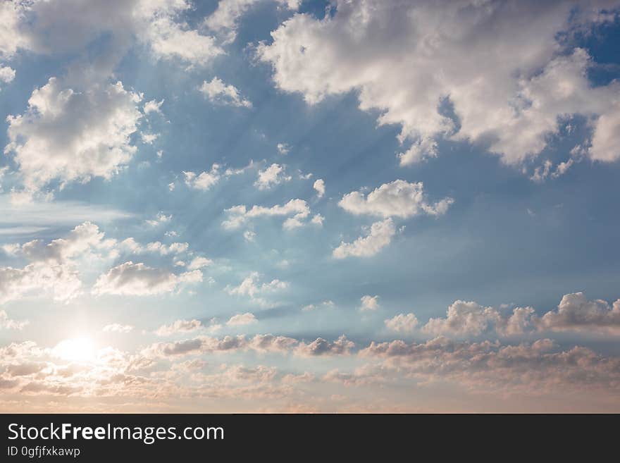 Fluffy white clouds on a sunny day. Fluffy white clouds on a sunny day.