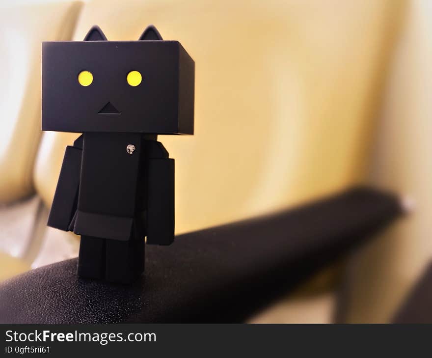 A black Danbo character on a railing.