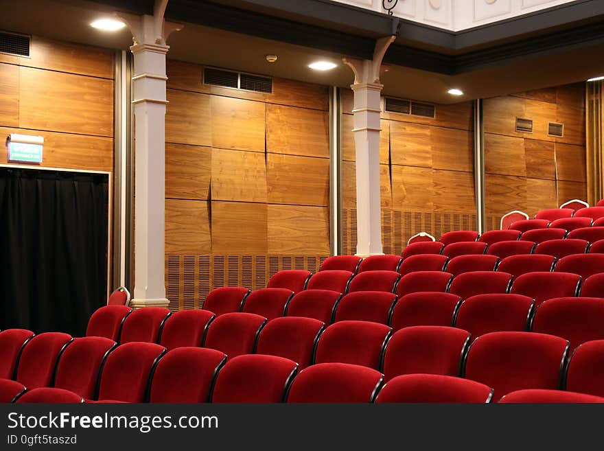 Red velvet seats in an auditorium. Red velvet seats in an auditorium.